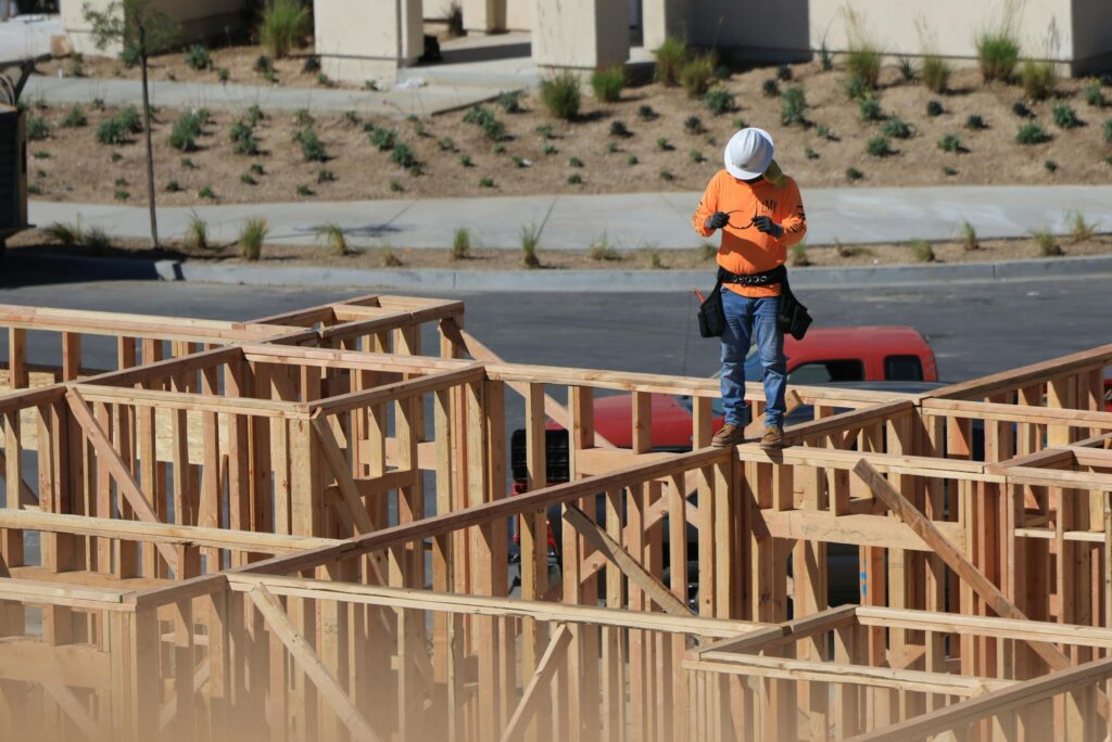 Man Standing on House Construction